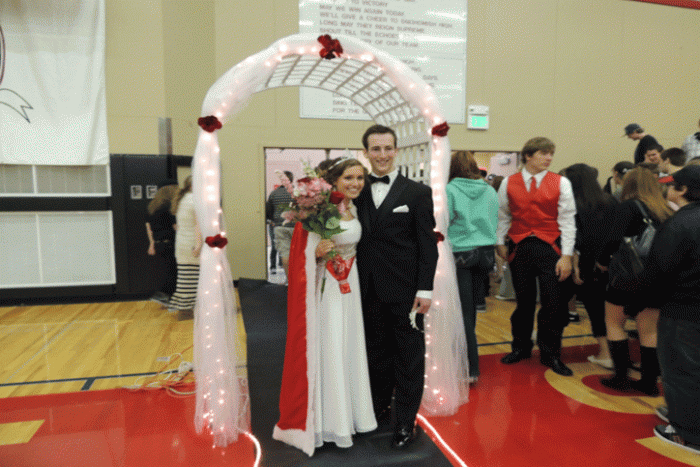 Homecoming Queen Hailey Henderson with her escort after the Coronation Assembly